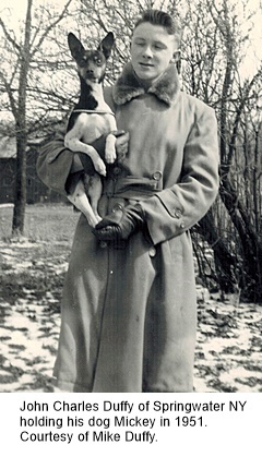 hcl_people_duffy_john_charles_holding_mickey_1951_resize240x360